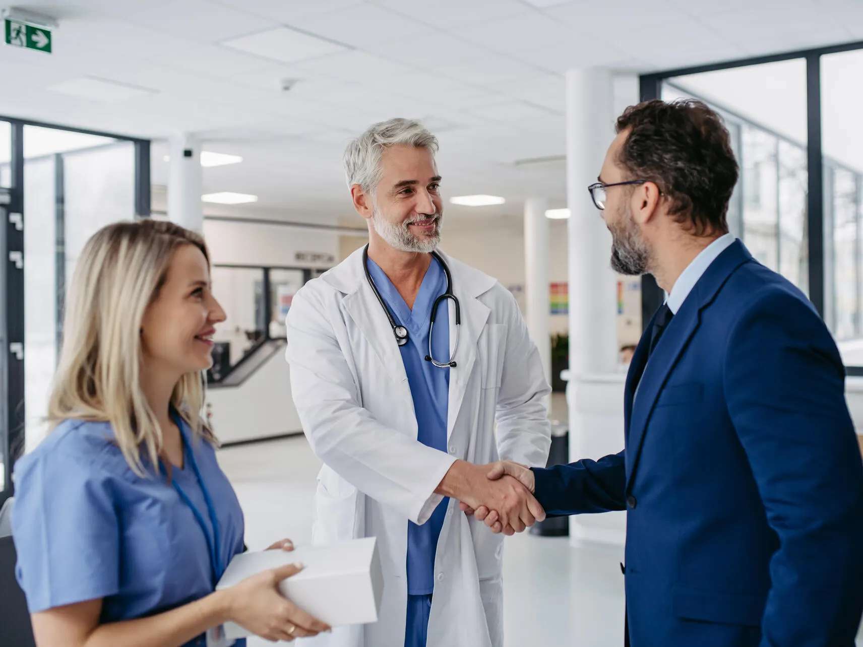 Baxter employee and healthcare professional shaking hands